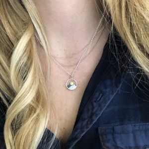 Handmade necklace with sun and mountain